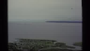 Alaska USA (1977): Drive Along Coast With Blue Then Gray Sky And Buildings