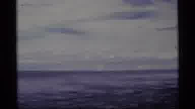 Alaska USA (1977): A Moving Video Of A Lake With Mountains In The Background