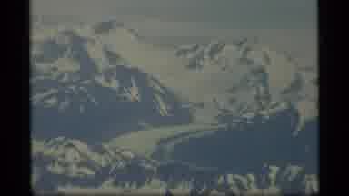 Alaska USA (1977): Flying Over Snowy Mountain Peaks Showing A Breathtaking View