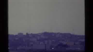 Alaska USA (1977): Vintage Video Footage Of Cityscape Past A Body Of Water During