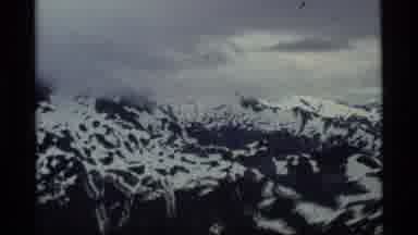 Alaska USA (1977): Vintage Video Camera Footage Of Plane Ride Over Snowy Mountains