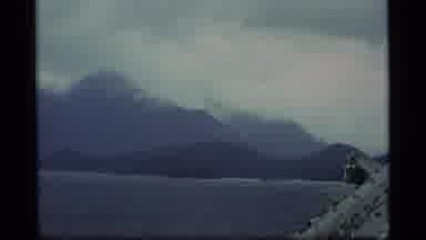 Alaska USA (1977): White Clouds Are Embracing A Large Mountain Range Bordering The