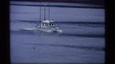 Alaska USA (1977): A Boat Motors Up A Large River Followed By Airplanes Parked On
