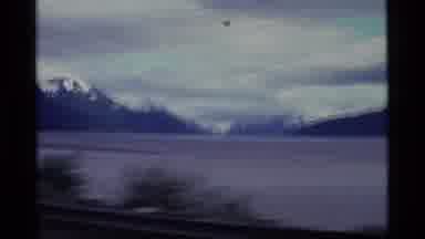 Alaska USA (1977): People Driving By Watching The Ocean And The Mountains