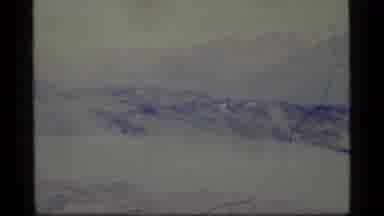 Alaska USA (1977): Stark Snowy Landscape With Mountain In The Back Snowing Cold