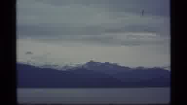 Alaska USA (1977): Right Pan And Zoom Of Rugged Mountain Range And Bay