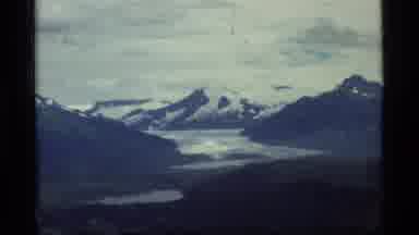 Glacier Bay Alaska USA (1977): Helicopter Flying Over Open Water And Mountains In