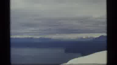 Glacier Bay Alaska USA (1977): Aerial View Of River And Mountain On A Cloudy Day