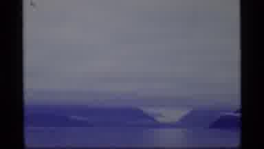 Glacier Bay Alaska USA (1977): Car Driving Through A Scenic Background Of Trees