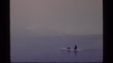 Glacier Bay Alaska USA (1977): Person Kayaking On Lake On A Cloudy Winter Day
