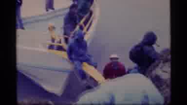 Glacier Bay Alaska USA (1977): People Climbing From Boat To Seaside Boulder On A