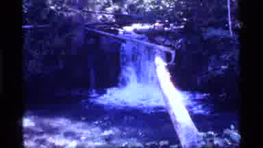 Sapphire Lake Montana USA (1977): Young Human On Log Across Small Waterfall