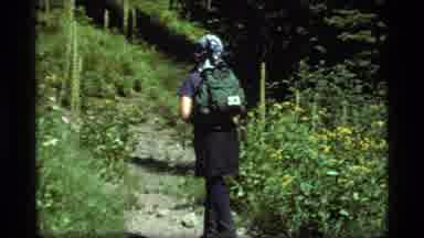Sapphire Lake Montana USA (1977): A Single Hiker Carrying A Backpack Follows A