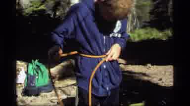 Sapphire Lake Montana USA (1977): A Young Boy Just Learned To Tie A Rope From His