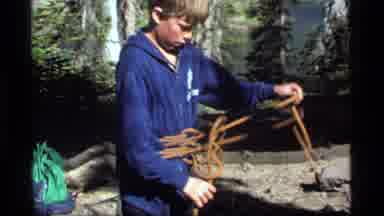Sapphire Lake Montana USA (1977): Two Boys Riding A Rope Around Their Waists And A