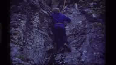 Sapphire Lake Montana USA (1977): Person Wearing Blue Shirt Repels Down Rocky