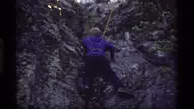 Sapphire Lake Montana USA (1977): A Kid Wearing A Blue Sweater Climbing Up A Rock