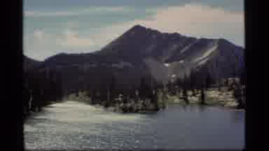 Sapphire Lake Montana USA (1977): View Of A Lake With A Mountain Behind It And A