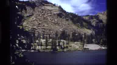 Sapphire Lake Montana USA (1977): Pan Of Mountains Behind A Lake