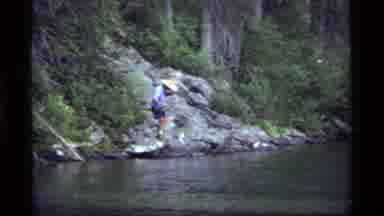 Sapphire Lake Montana USA (1977): Man In Shorts And A Hat Walking Across Rocky