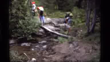 Sapphire Lake Montana USA (1977): Three People Walking Over A Log Very Carefully