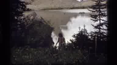 Sapphire Lake Montana USA (1977): Hiker Walking Through Woods With Lake And