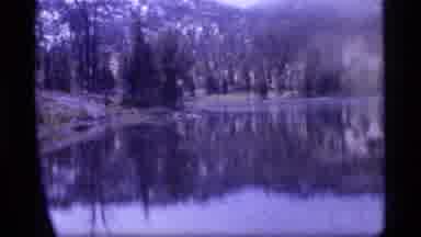 Sapphire Lake Montana USA (1977): Two Men Fishing With Rods Stand On Rocks In A