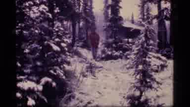 Sapphire Lake Montana USA (1977): Man In A Red Coat Walks Through A Snowy Woodland