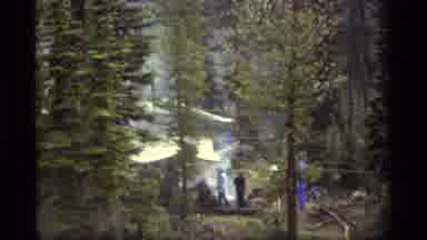 Sapphire Lake Montana USA (1977): A Couple Of People Gather Around A Daytime