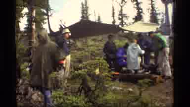 Sapphire Lake Montana USA (1977): Campers Gathered In Forest Wearing Rain Slickers