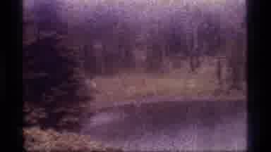 Sapphire Lake Montana USA (1977): Heavy Rain Falling And People Walking Speedy