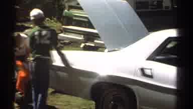 Lake Tahoe California USA (1978): Poor Family At A Junkyard Tearing Apart A Car