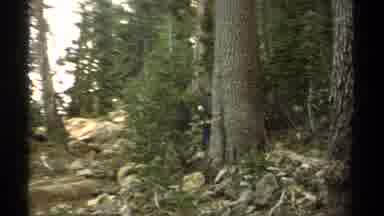 Lake Tahoe California USA (1978): Hikers With Blue Backpacks Walking Up A Rocky