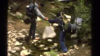 Lake Tahoe California USA (1978): People Hiking Rocky Terrain Large Backpacks