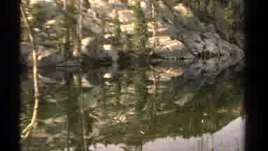 Lake Tahoe California USA (1978): Body Of Water Surrounded By Trees And Large Tall