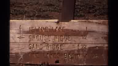 Lake Tahoe California USA (1978): Man Hikes Trail Wile Near A Sign With Directions
