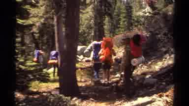 Lake Tahoe California USA (1978): Hikers Walking With Backpacks On A Trail In A