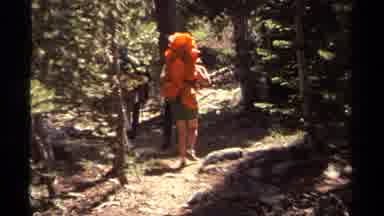 Lake Tahoe California USA (1978): Two Heavily Packed Hikers Slow Behind Group For