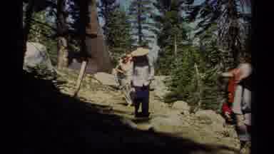 Lake Tahoe California USA (1978): A Group Of Hikers With Backpacks Walking Down A