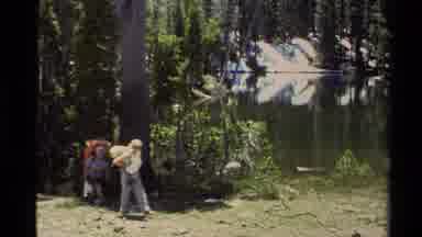 Lake Tahoe California USA (1978): Group Of People Hiking Through Forest Carrying