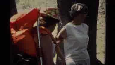 Lake Tahoe California USA (1978): People With Camping Gear Talking One Is