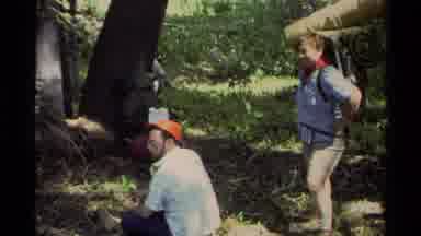Lake Tahoe California USA (1978): Seated Man And Standing Woman With Camping Gear