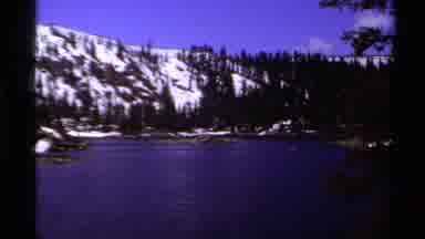 Lake Tahoe California USA (1978): Snowy Mountain Overlooking A Calm River