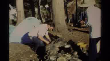 Lake Tahoe California USA (1978): People Trying To Light The Campfire While