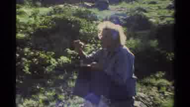 Lake Tahoe California USA (1978): People Sitting On Rocks Eating Food On A Bright