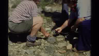 Lake Tahoe California USA (1978): Rock Hounds Study A Large Rock With A Magnifying