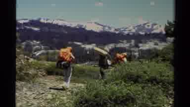 Lake Tahoe California USA (1978): Big Group Of Hikers Carry Packs Into The