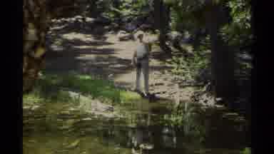 Lake Tahoe California USA (1978): A Person In A Uniform Standing By Water And
