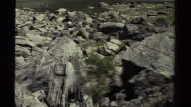 British Columbia Canada (1979): Panning Across Rocks And Boulders Then A View Of A