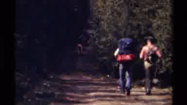British Columbia Canada (1979): Two People Walking Down A Dirt Road With